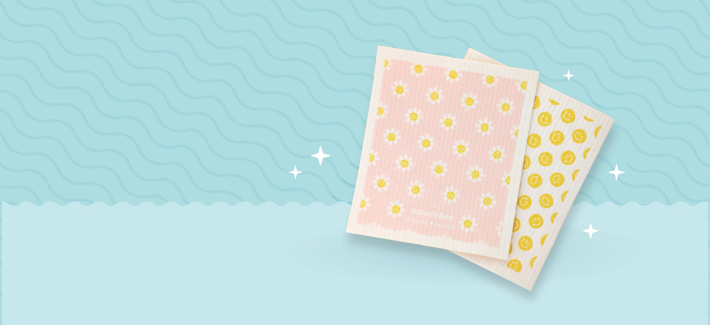 Kitchen dishcloths that are customizable with your own branding or designs. You can put your own artwork or logo on them. One Swedish dishcloth is pink with flowers and the other has yellow smiley faces on it