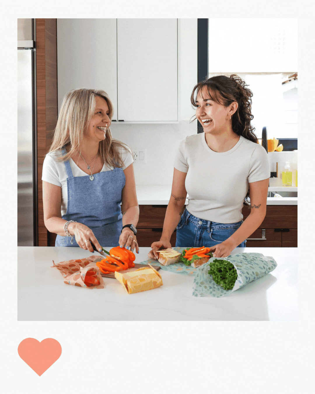 Polaroid instagram image with mom and daughter in the kitchen laughing together while making lunch. they are using beeswax food wraps from Nature Bee to keep their food fresh