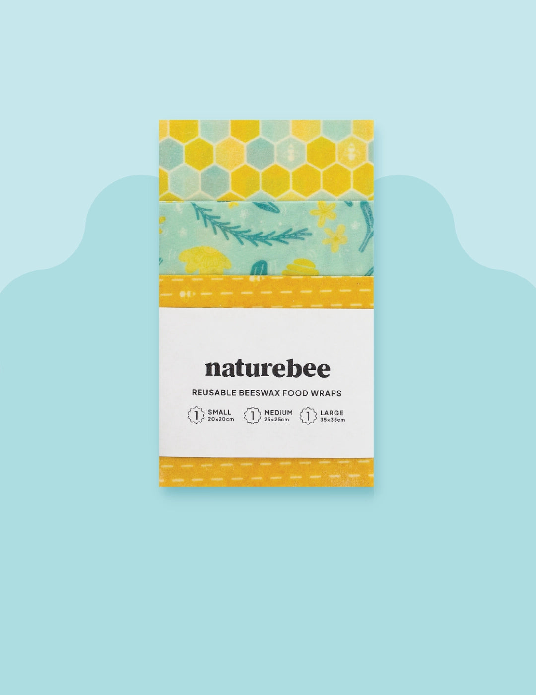 Straight on, close up image of someones hands holding a small beeswax food wrap with a bright and trendy strawberry pattern. The wrap has a pile of fresh and juicy sliced strawberries in it that  